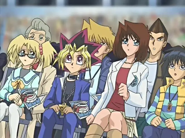 Momen Nonton Bareng yang Tak Terlupakan Sebuah gambar yang menampilkan sekelompok teman yang sedang menonton Yu-Gi-Oh! di televisi.