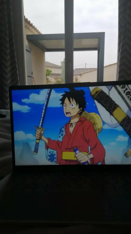 Menonton Anime Secara Online Laptop menampilkan situs streaming anime