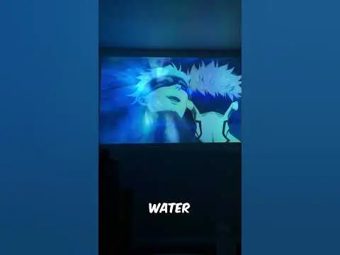 Nikmati Pengalaman Menonton Anime yang Terbaik Gambar seseorang yang sedang menonton anime dengan nyaman di perangkatnya