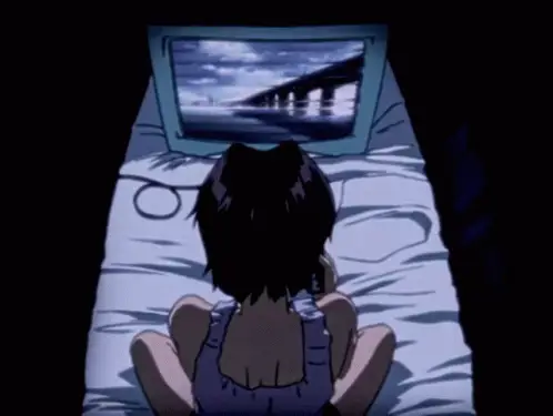Menonton Anime dengan Nyaman Seseorang menonton anime di laptop