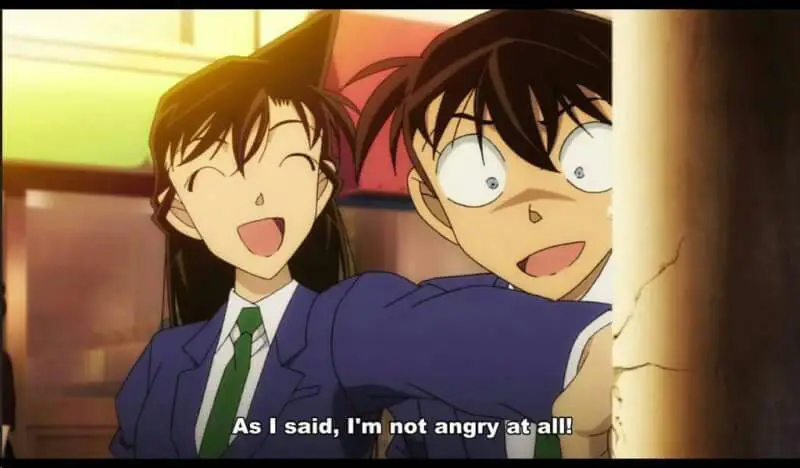Menikmati keseruan Detektif Conan Gambar adegan seseorang menonton anime Detektif Conan